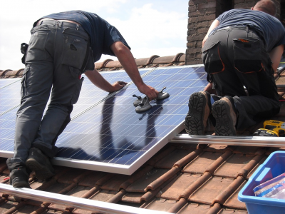 a man installing solar panels in california