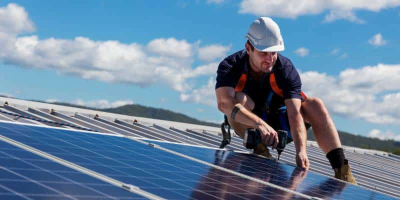 A man put solar panels on the roof - sunnysolar